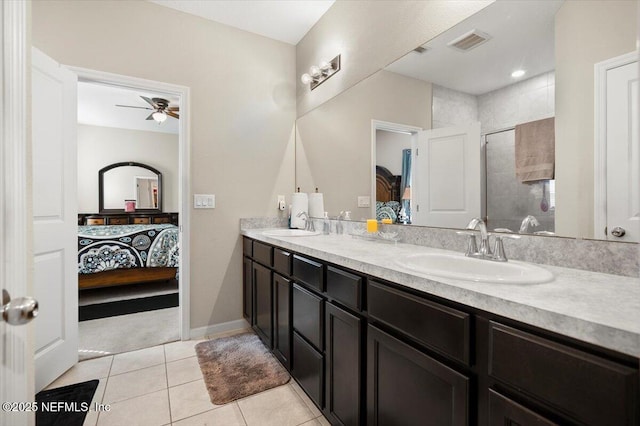 bathroom with walk in shower, ceiling fan, tile patterned floors, and vanity