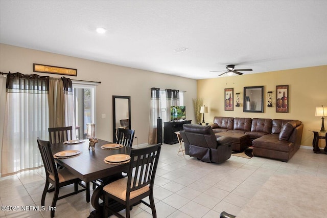 dining room featuring light tile patterned flooring and ceiling fan