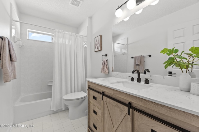 full bathroom featuring shower / bath combination with curtain, vanity, toilet, tile patterned floors, and a textured ceiling