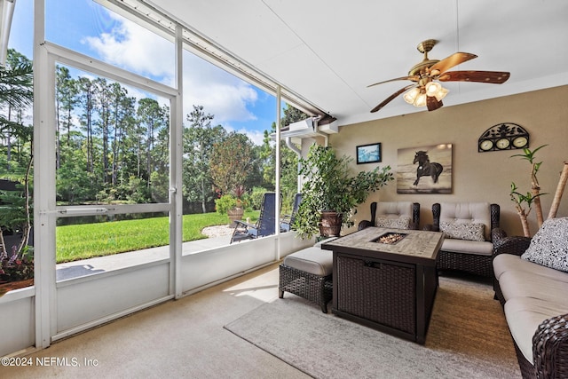 sunroom / solarium featuring ceiling fan