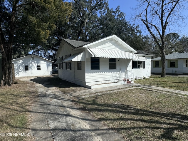 view of front of property with an outbuilding