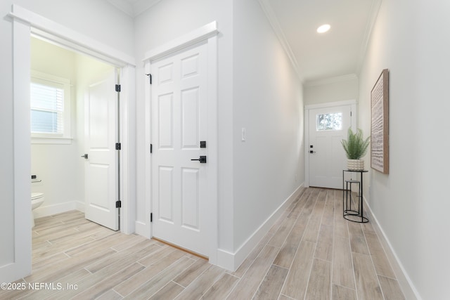 corridor featuring crown molding