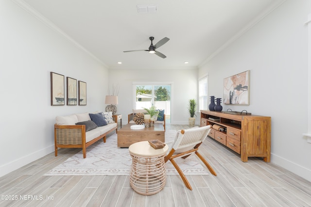 sitting room featuring crown molding and ceiling fan