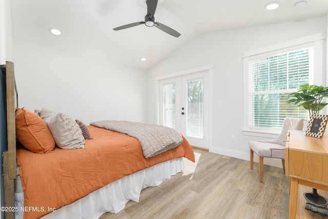 bedroom featuring vaulted ceiling, access to outside, ceiling fan, light hardwood / wood-style floors, and french doors