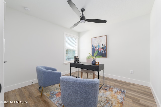 home office with hardwood / wood-style flooring and ceiling fan