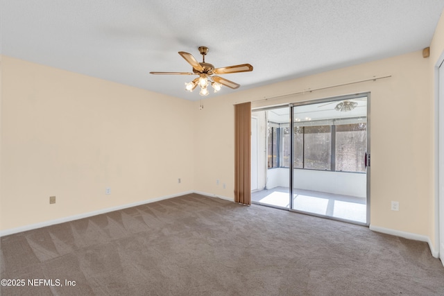 unfurnished room with ceiling fan, a textured ceiling, and carpet flooring