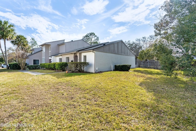 view of property exterior with a lawn