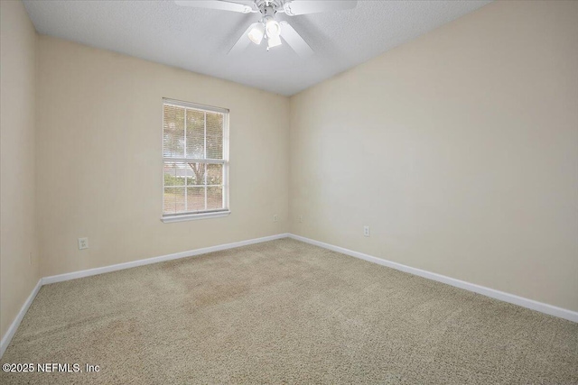 unfurnished room featuring carpet flooring, a textured ceiling, and ceiling fan