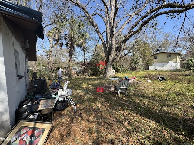 view of yard with central AC unit