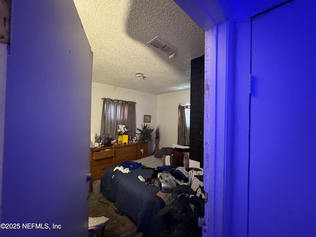 bedroom featuring a textured ceiling