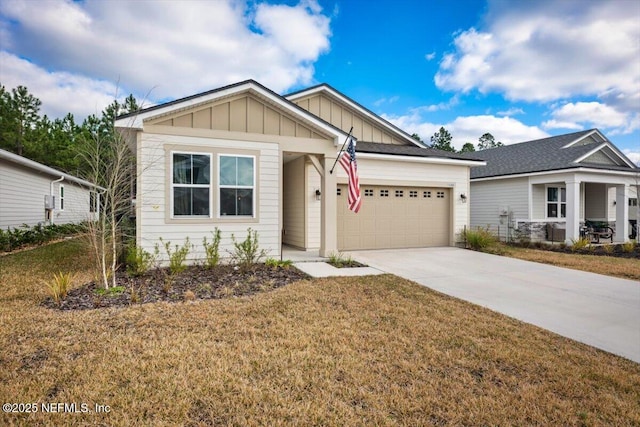 craftsman-style house featuring a garage and a front yard