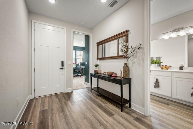 entrance foyer with light wood-type flooring