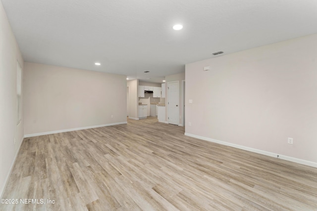 unfurnished living room featuring light hardwood / wood-style flooring