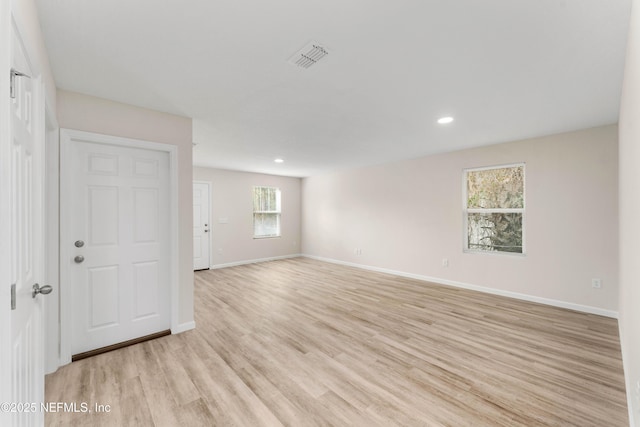 spare room with light wood-type flooring