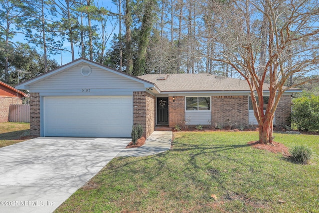 single story home featuring a garage and a front lawn