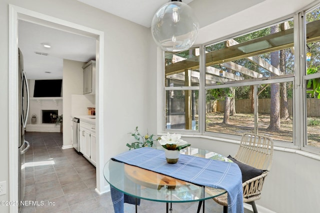 dining space featuring light tile patterned floors