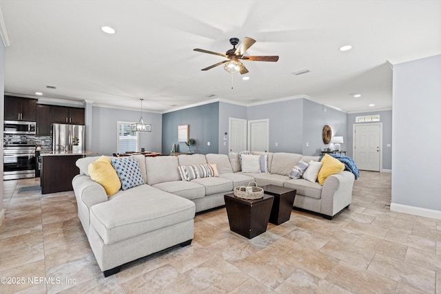 living room with baseboards, recessed lighting, ceiling fan with notable chandelier, and crown molding