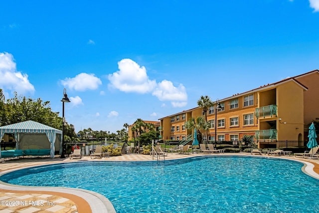 view of swimming pool featuring a gazebo