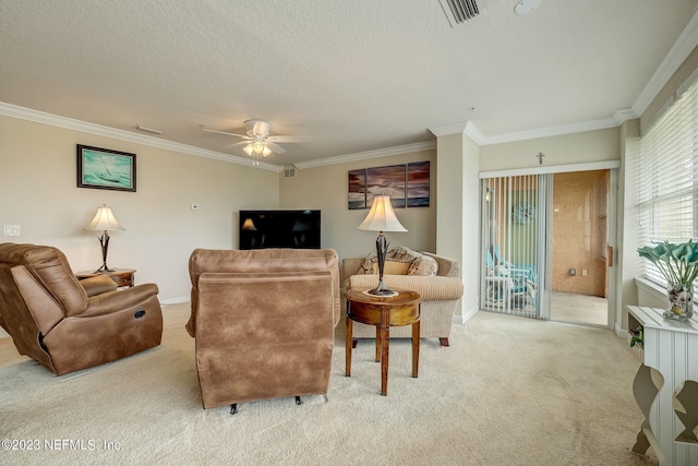 carpeted living room with ceiling fan, crown molding, and a textured ceiling