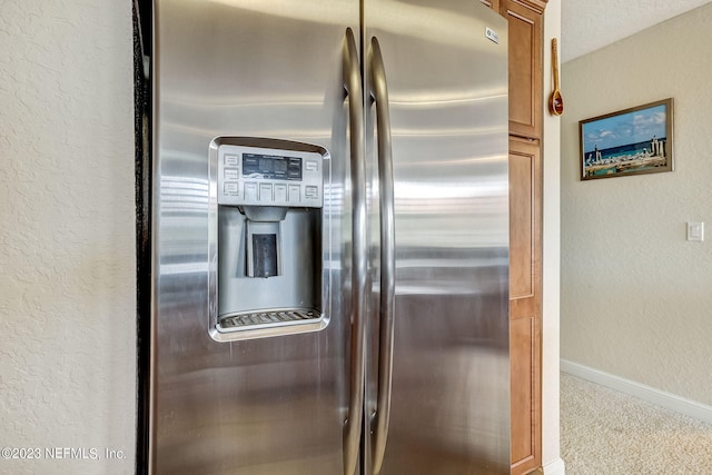 kitchen with light carpet and stainless steel fridge with ice dispenser