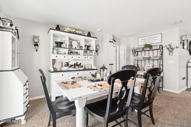 dining area featuring carpet