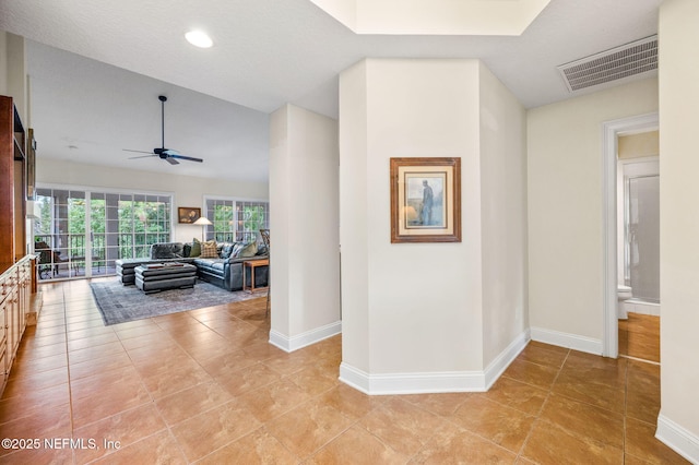 hallway with light tile patterned floors