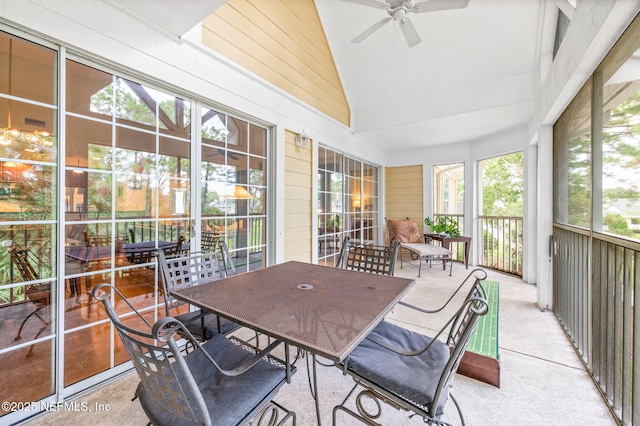 sunroom / solarium with lofted ceiling and ceiling fan