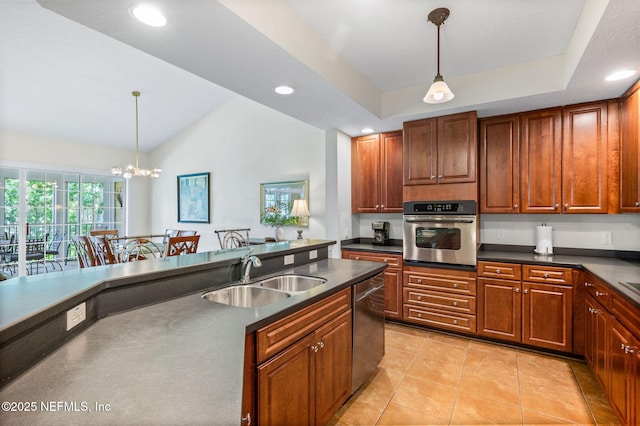 kitchen with hanging light fixtures, appliances with stainless steel finishes, sink, and light tile patterned floors