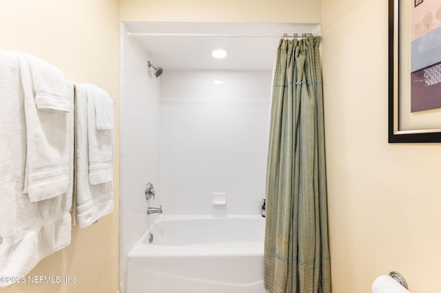 bathroom with shower / bathtub combination with curtain