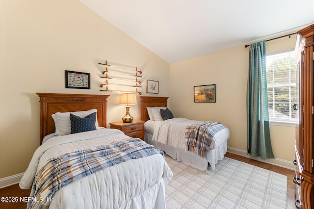 bedroom with lofted ceiling