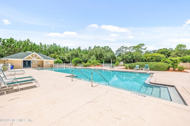 view of pool featuring a patio