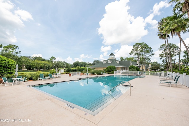 view of swimming pool featuring a patio area