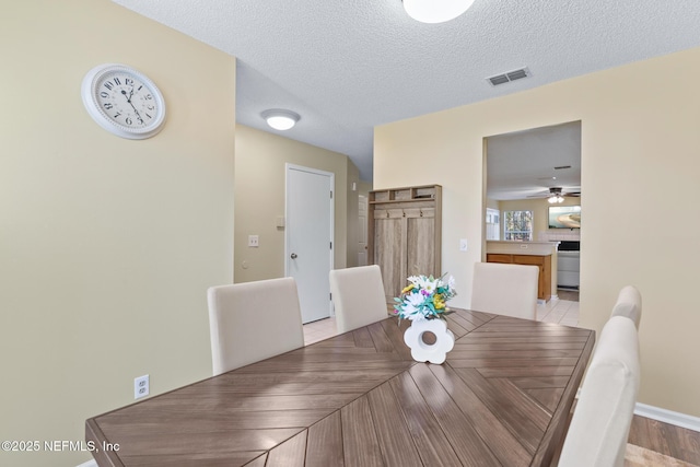 dining area with a textured ceiling