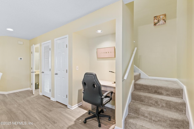 office area with light hardwood / wood-style flooring