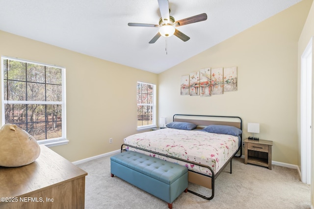 carpeted bedroom featuring vaulted ceiling and ceiling fan