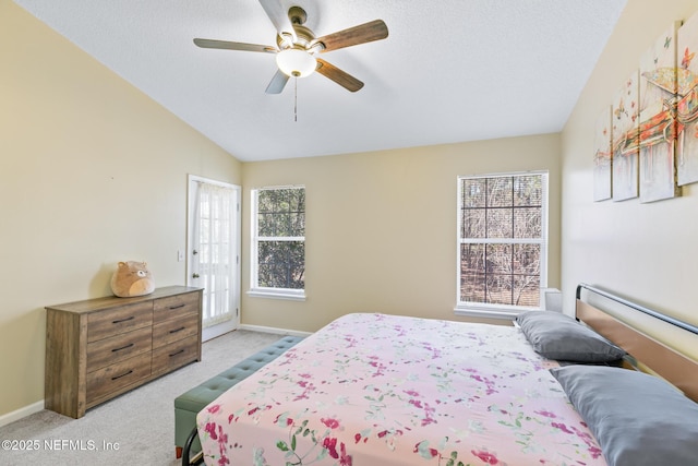 bedroom featuring vaulted ceiling, access to exterior, ceiling fan, light carpet, and a textured ceiling