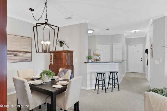 10961 Burnt Mill Rd Unit 425, Jacksonville, FL 32256 - carpeted dining area featuring crown molding and a notable chandelier