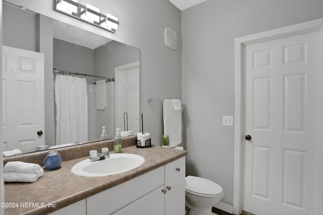 10961 Burnt Mill Rd Unit 425, Jacksonville, FL 32256 - bathroom featuring vanity, toilet, and walk in shower