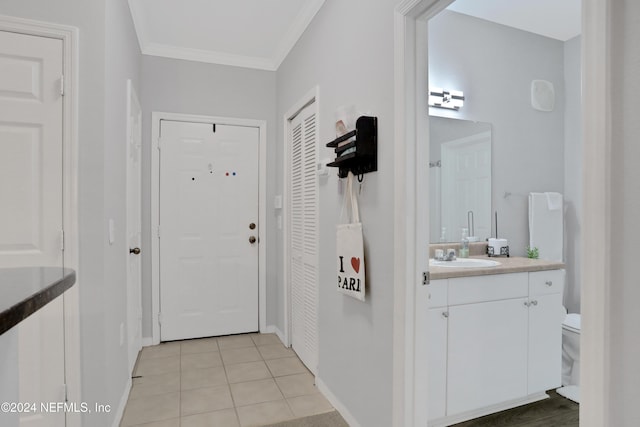 10961 Burnt Mill Rd Unit 425, Jacksonville, FL 32256 - interior space featuring ornamental molding, sink, and light tile patterned floors