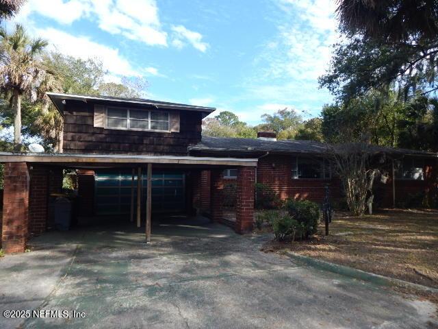 view of front of property with a carport