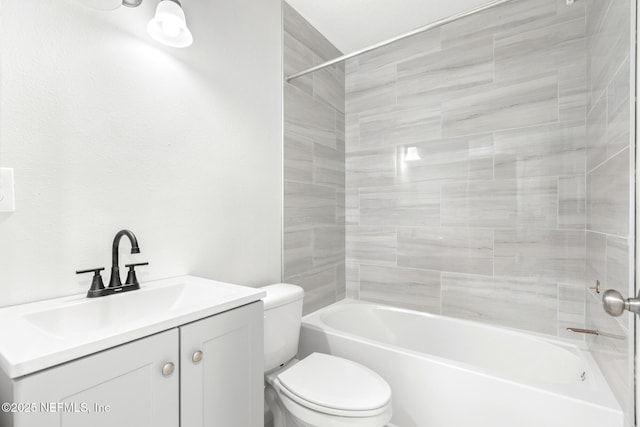 bathroom with toilet, shower / tub combination, and vanity