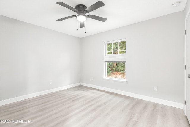 unfurnished room with light wood-style floors, a ceiling fan, and baseboards