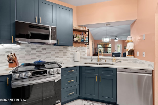 kitchen with a sink, decorative backsplash, stainless steel appliances, and light countertops