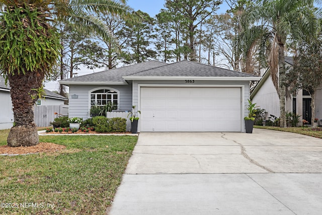 single story home featuring a front yard, concrete driveway, roof with shingles, and an attached garage