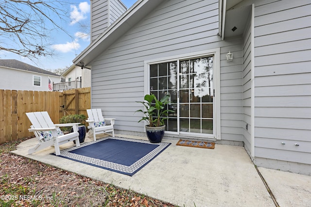 view of patio / terrace featuring fence