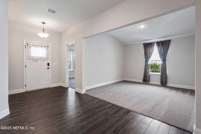 foyer entrance featuring dark hardwood / wood-style flooring