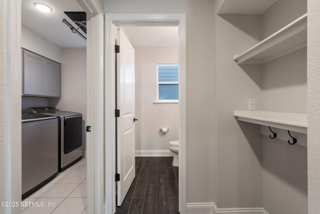 bathroom with separate washer and dryer