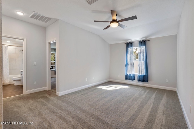 interior space with lofted ceiling and ceiling fan