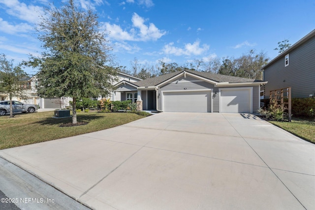 view of front of home with a front lawn and a garage