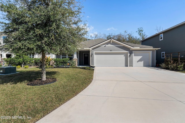 view of front of house with a garage and a front lawn